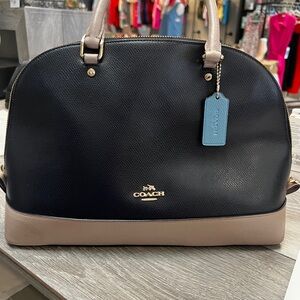 Blue/Tan Coach handbag.